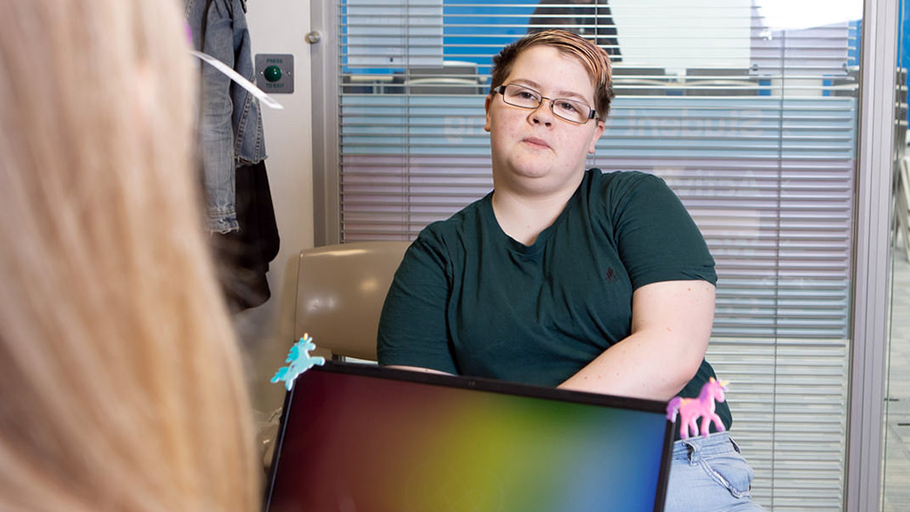 A student talking to a College advisor