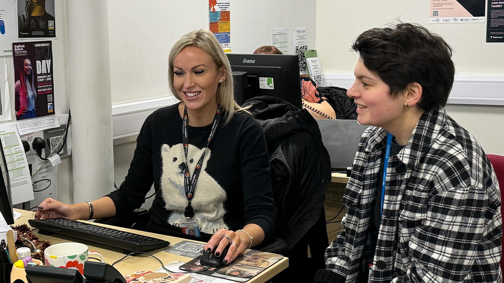 A student taking careers advice from an advisor