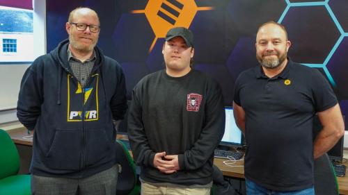 Student and tutor with the graphic wall design 